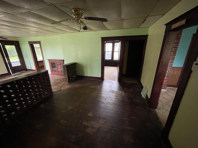 20621 County Highway 22, Hoyleton, IL 62803 - unfurnished living room with a paneled ceiling, a ceiling fan, baseboards, and a fireplace