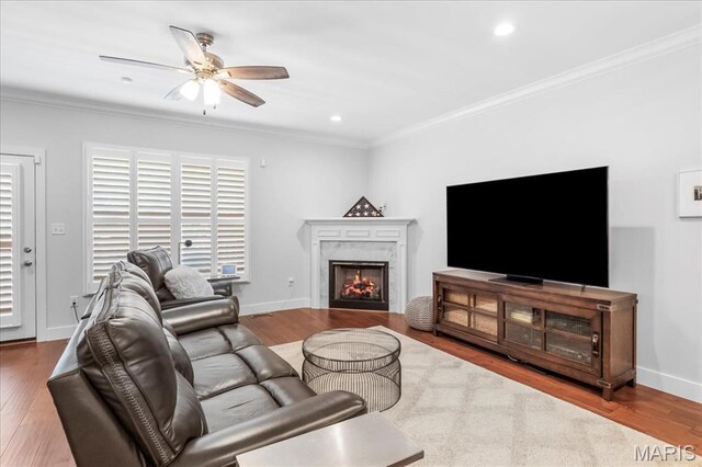 7723 Dale Ave, Richmond Heights, MO 63117 - living room featuring ceiling fan, ornamental molding, wood finished floors, a high end fireplace, and recessed lighting