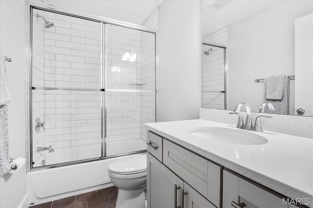 7723 Dale Ave, Richmond Heights, MO 63117 - bathroom with vanity, toilet, bath / shower combo with glass door, and tile patterned flooring