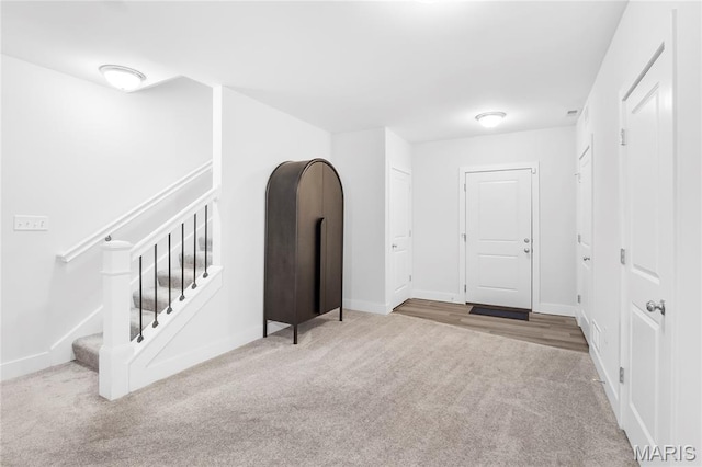 7723 Dale Ave, Richmond Heights, MO 63117 - carpeted foyer entrance with baseboards and stairs