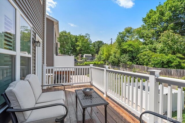 7723 Dale Ave, Richmond Heights, MO 63117 - wooden terrace with a fenced backyard and view of scattered trees