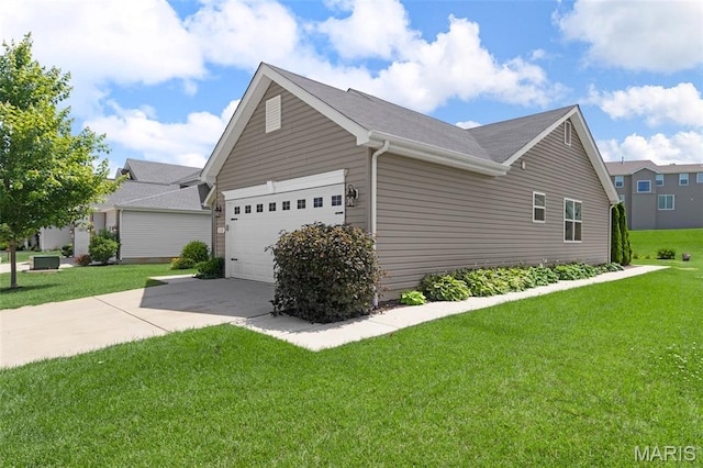 119 Hidden Bluffs Dr, Lake St Louis, MO 63367 - view of side of home with concrete driveway, a garage, and a lawn