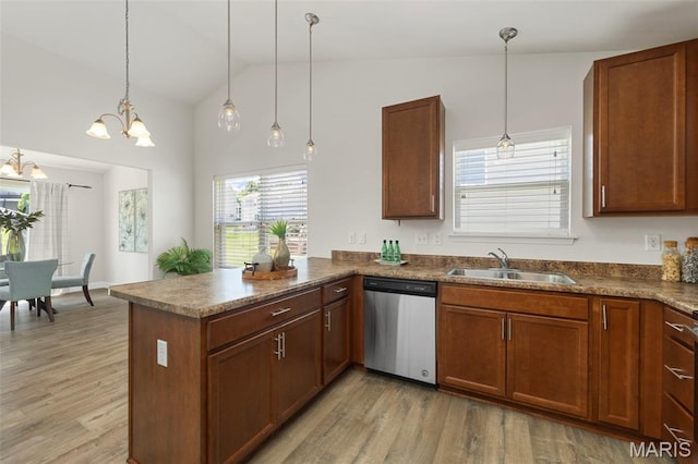 119 Hidden Bluffs Dr, Lake St Louis, MO 63367 - kitchen featuring stainless steel dishwasher, a peninsula, light wood-style floors, vaulted ceiling, and a chandelier