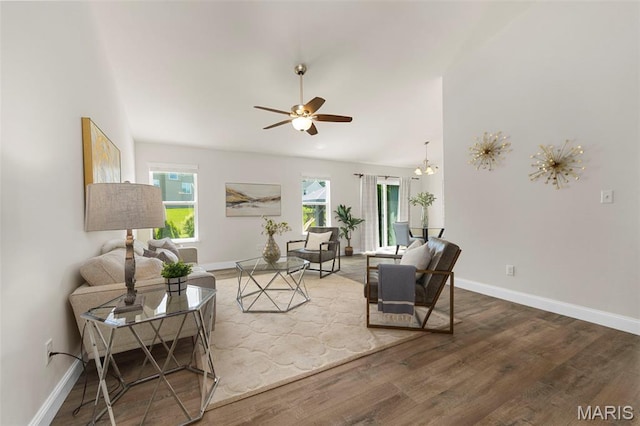 119 Hidden Bluffs Dr, Lake St Louis, MO 63367 - living area featuring ceiling fan, wood finished floors, and vaulted ceiling
