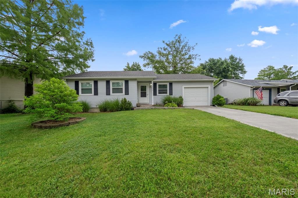 2006 Winter Hill Dr, Ofallon, MO 63366 - ranch-style house featuring driveway, an attached garage, and a front yard