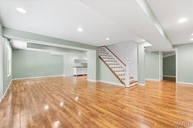 1519 Scofield Valley Ln, Wildwood, MO 63038 - unfurnished living room with wood finished floors, stairway, and recessed lighting