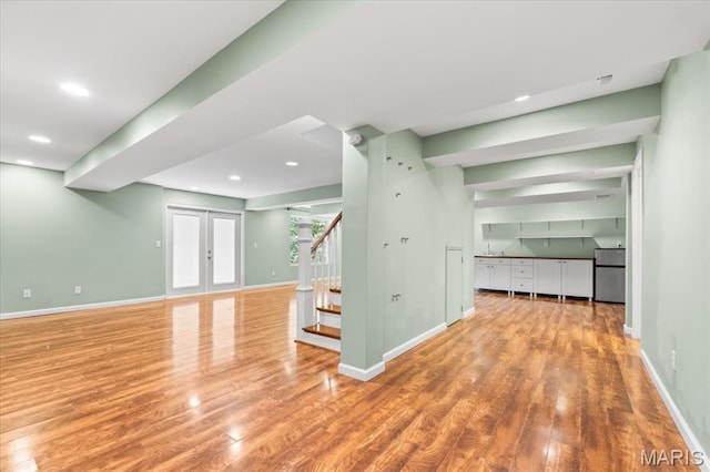 1519 Scofield Valley Ln, Wildwood, MO 63038 - unfurnished living room with wood finished floors, stairway, and recessed lighting