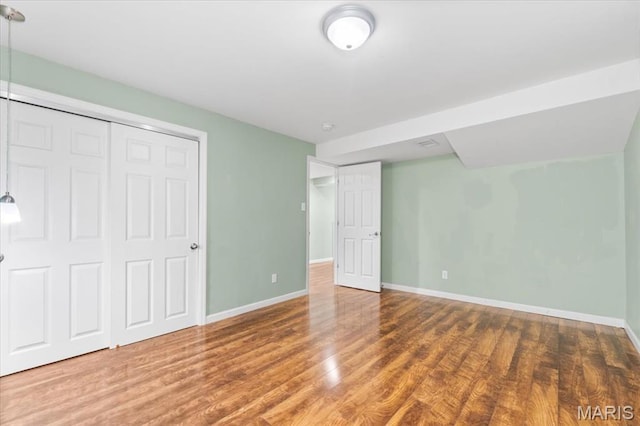 1519 Scofield Valley Ln, Wildwood, MO 63038 - unfurnished bedroom featuring wood finished floors and a closet