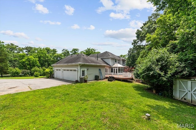 1519 Scofield Valley Ln, Wildwood, MO 63038 - view of front of property featuring an attached garage, a front yard, concrete driveway, a wooden deck, and a shed