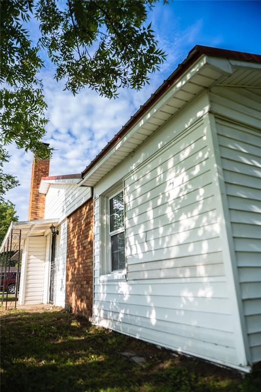 216 Patty Lynn Dr, Kennett, MO 63857 - view of property exterior featuring a chimney