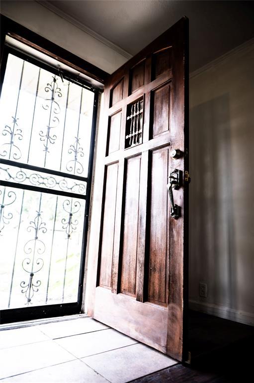 216 Patty Lynn Dr, Kennett, MO 63857 - doorway to outside featuring crown molding and healthy amount of natural light