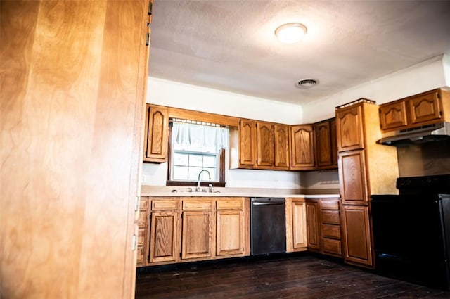 216 Patty Lynn Dr, Kennett, MO 63857 - kitchen featuring under cabinet range hood, stainless steel dishwasher, a sink, black range with electric stovetop, and light countertops