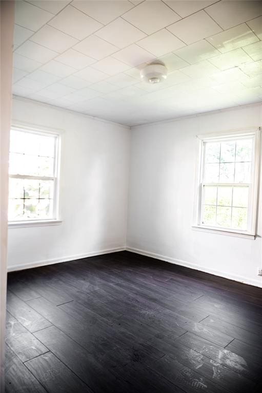 216 Patty Lynn Dr, Kennett, MO 63857 - spare room with dark wood-style floors and baseboards