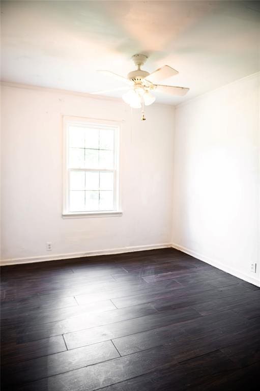216 Patty Lynn Dr, Kennett, MO 63857 - spare room featuring a ceiling fan, dark wood-type flooring, and baseboards
