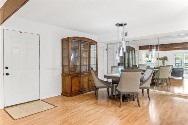15017 Baxter Vlg Unit B, Chesterfield, MO 63017 - dining room featuring light wood-style flooring and baseboards