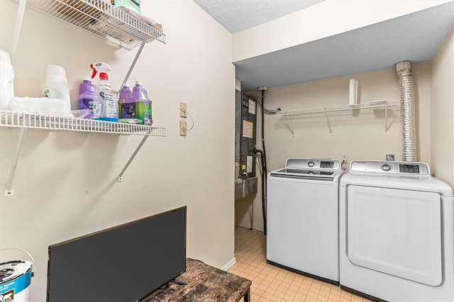 15017 Baxter Vlg Unit B, Chesterfield, MO 63017 - laundry area with washing machine and clothes dryer and light tile patterned flooring