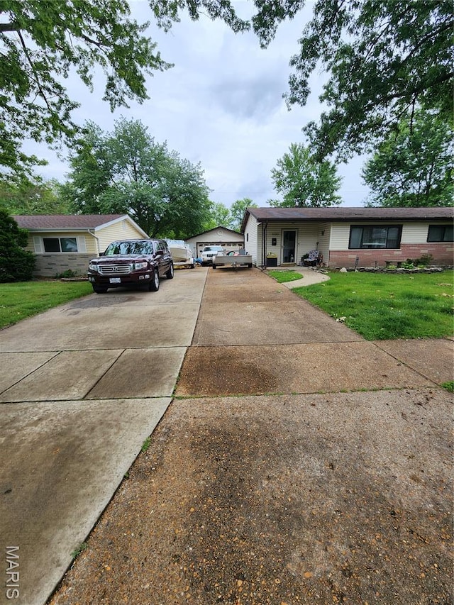 1520 Flicker Dr, Florissant, MO 63031 - view of front of home with concrete driveway, a front yard, and brick siding