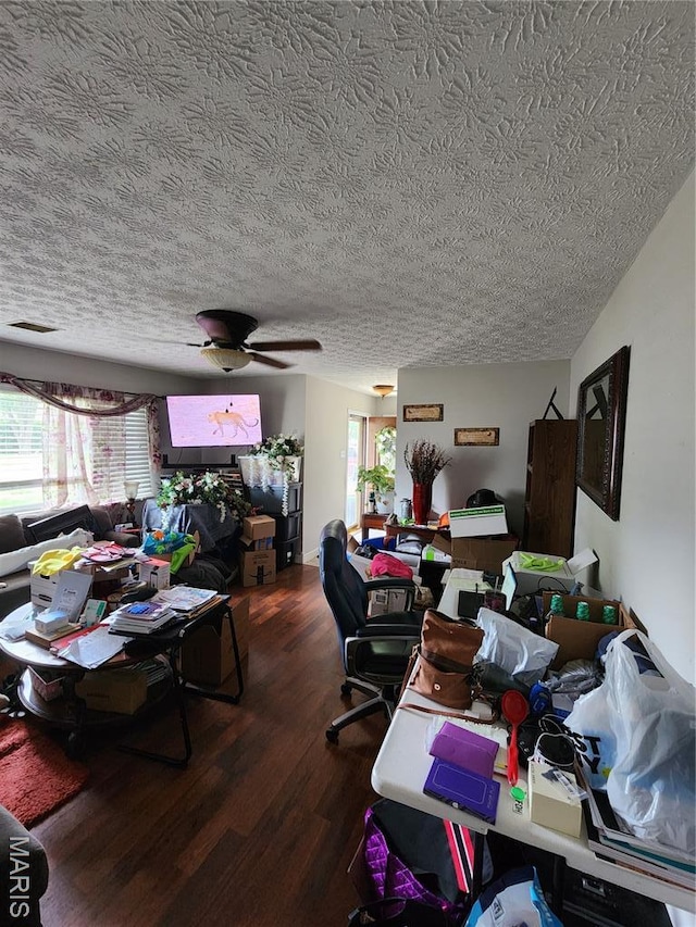1520 Flicker Dr, Florissant, MO 63031 - living area with a textured ceiling and dark wood-style floors