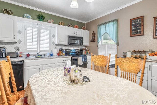 406 N Division St, Bonne Terre, MO 63628 - kitchen featuring black appliances, a sink, white cabinets, crown molding, and backsplash