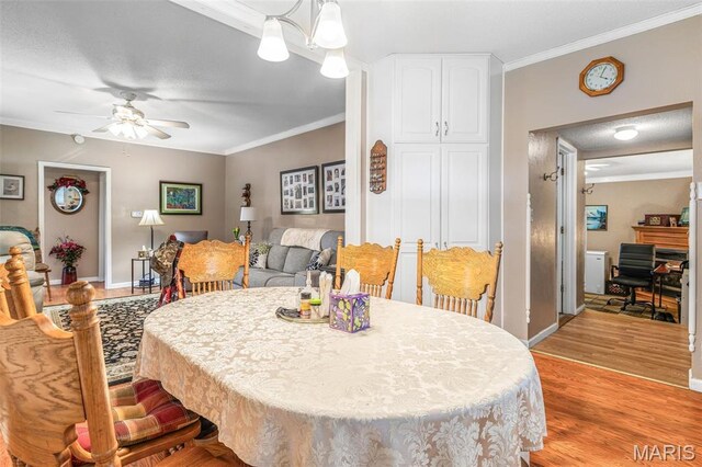 406 N Division St, Bonne Terre, MO 63628 - dining room featuring ornamental molding, light wood-style flooring, a ceiling fan, and baseboards