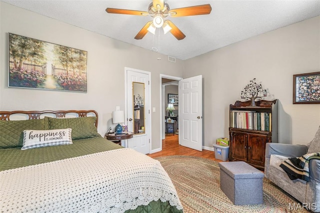 406 N Division St, Bonne Terre, MO 63628 - bedroom with wood finished floors, baseboards, and ceiling fan