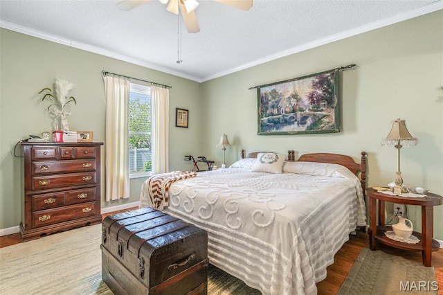 406 N Division St, Bonne Terre, MO 63628 - bedroom with wood finished floors, crown molding, baseboards, a textured ceiling, and a ceiling fan