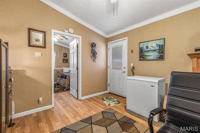 406 N Division St, Bonne Terre, MO 63628 - laundry room with light wood-type flooring, crown molding, baseboards, and a textured ceiling