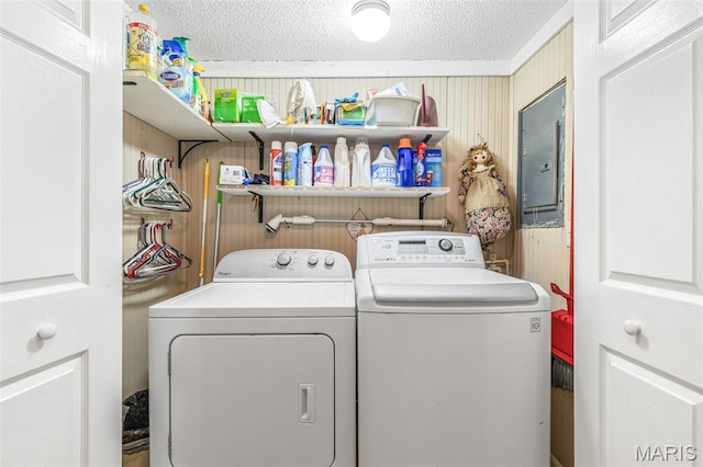 406 N Division St, Bonne Terre, MO 63628 - laundry area featuring independent washer and dryer, electric panel, a textured ceiling, and wooden walls