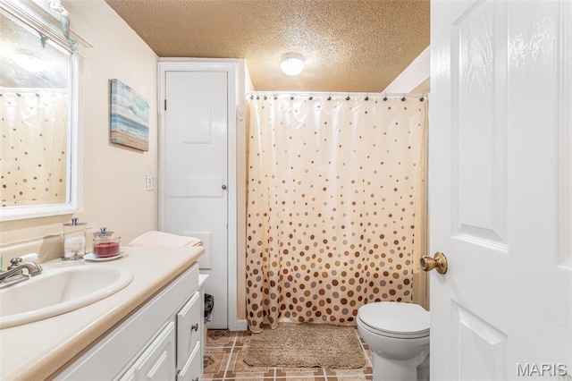 406 N Division St, Bonne Terre, MO 63628 - bathroom with vanity, toilet, a textured ceiling, a shower with shower curtain, and tile patterned flooring