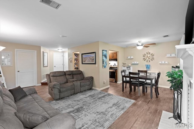 1001 Windstream Dr Unit 32, Saint Peters, MO 63376 - living area with ceiling fan, light wood-style flooring, and baseboards