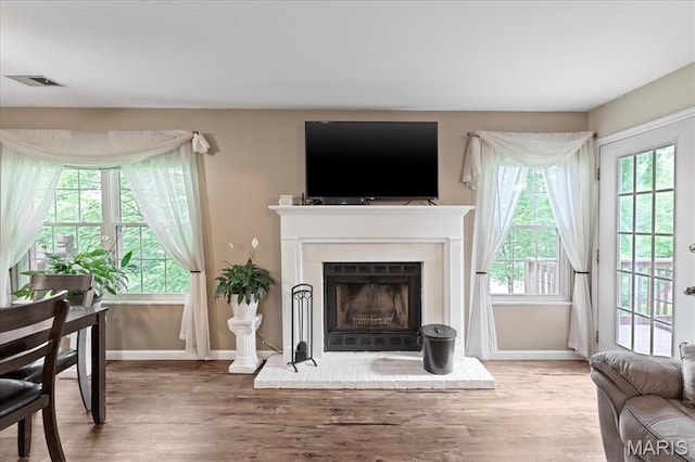 1001 Windstream Dr Unit 32, Saint Peters, MO 63376 - living room with baseboards, wood finished floors, and healthy amount of natural light