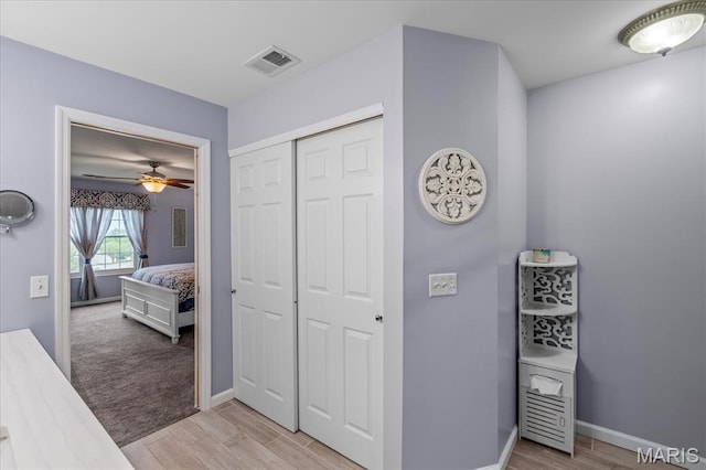 1001 Windstream Dr Unit 32, Saint Peters, MO 63376 - hallway with light wood-type flooring and baseboards