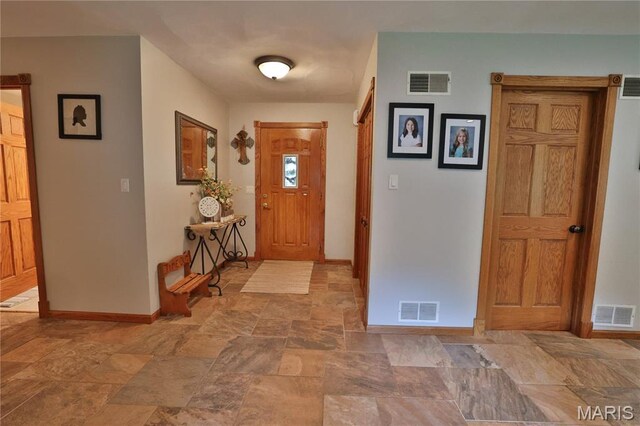 306 Lakewood Dr, Hillsboro, IL 62049 - entryway with stone finish flooring and baseboards