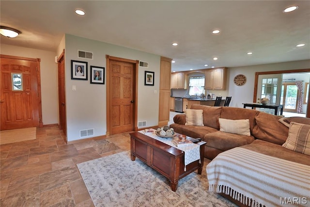 306 Lakewood Dr, Hillsboro, IL 62049 - living area featuring light stone finish flooring, recessed lighting, and baseboards