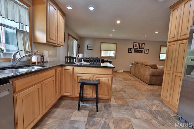 306 Lakewood Dr, Hillsboro, IL 62049 - kitchen with a sink, stone tile floors, dishwasher, recessed lighting, and open floor plan