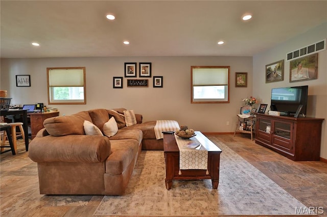 306 Lakewood Dr, Hillsboro, IL 62049 - living room with recessed lighting, stone tile flooring, and baseboards