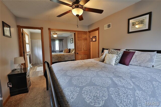 306 Lakewood Dr, Hillsboro, IL 62049 - bedroom featuring carpet floors, ceiling fan, a closet, and baseboards