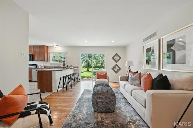 1214 Iron Warrior Ln, Ballwin, MO 63011 - living area with light wood finished floors and recessed lighting