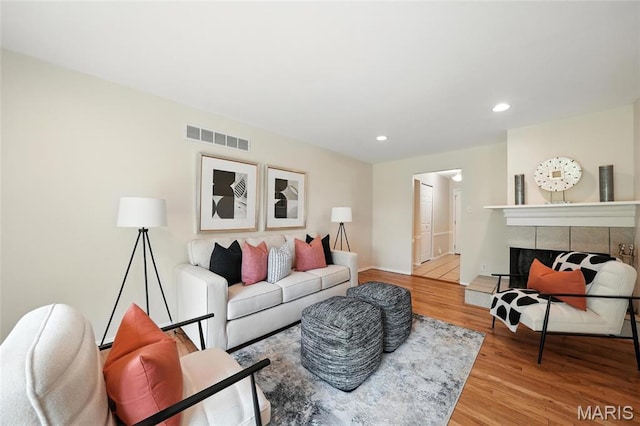1214 Iron Warrior Ln, Ballwin, MO 63011 - living area with wood finished floors, recessed lighting, and a fireplace