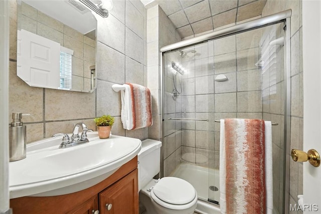 1214 Iron Warrior Ln, Ballwin, MO 63011 - bathroom with vanity, tile walls, and a stall shower