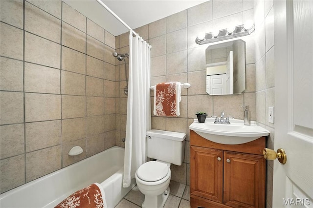 1214 Iron Warrior Ln, Ballwin, MO 63011 - bathroom featuring tile walls, vanity, tile patterned floors, and shower / tub combo
