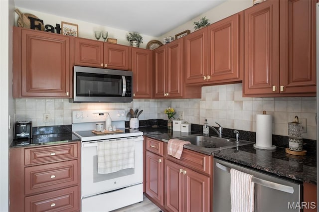 621 Sugar Trail Ct Unit 4, Saint Peters, MO 63376 - kitchen with stainless steel appliances, a sink, tasteful backsplash, dark stone counters, and brown cabinetry