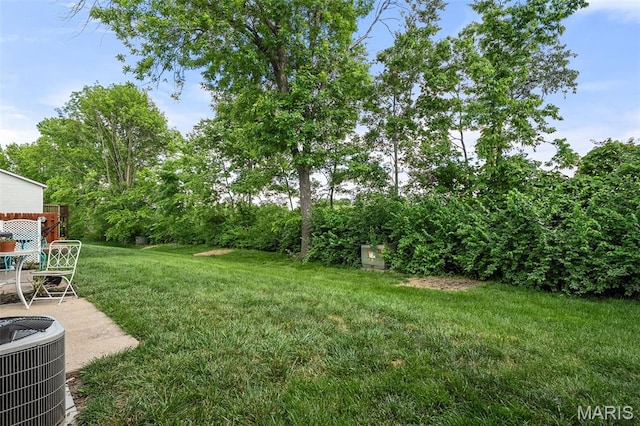 621 Sugar Trail Ct Unit 4, Saint Peters, MO 63376 - view of grassy yard with central AC and a patio area