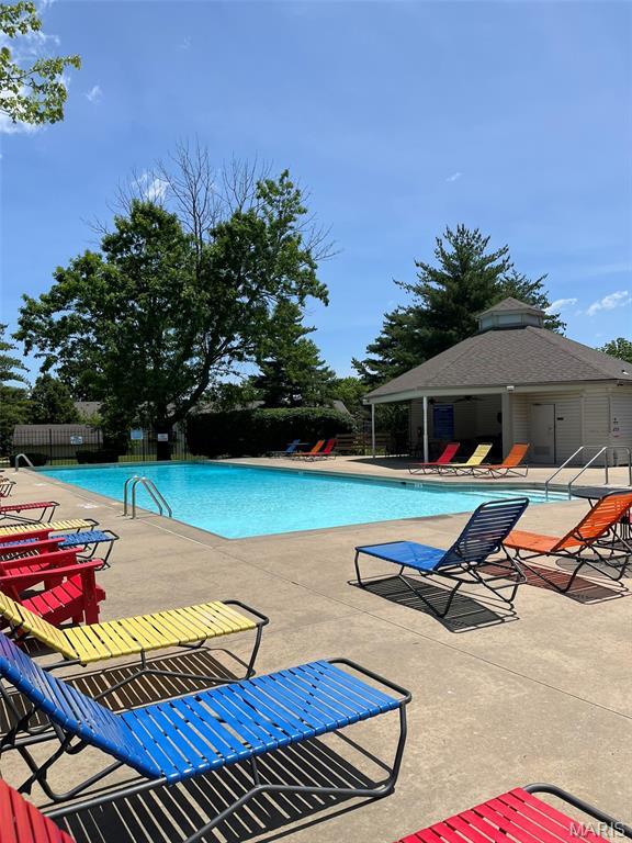 621 Sugar Trail Ct Unit 4, Saint Peters, MO 63376 - community pool featuring a patio