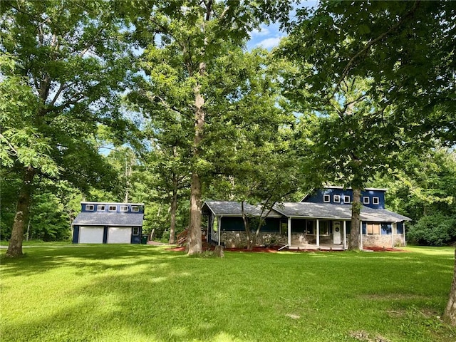 12185 Oak Meadow Dr, Rolla, MO 65401 - view of front of property with a porch, a front lawn, an outdoor structure, and view of scattered trees