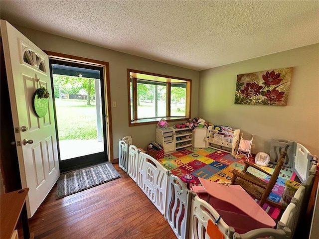 12185 Oak Meadow Dr, Rolla, MO 65401 - dining area featuring a textured ceiling and wood finished floors
