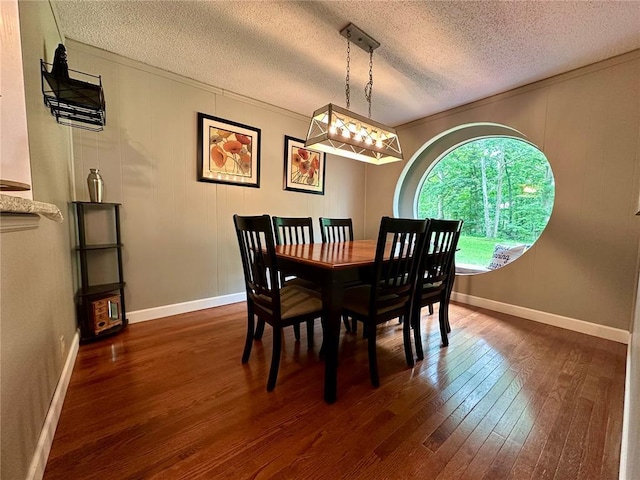 12185 Oak Meadow Dr, Rolla, MO 65401 - dining room featuring dark wood-style flooring, a textured ceiling, and baseboards