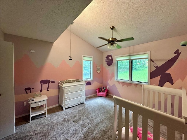 12185 Oak Meadow Dr, Rolla, MO 65401 - carpeted bedroom with a textured ceiling, lofted ceiling, a ceiling fan, and baseboards