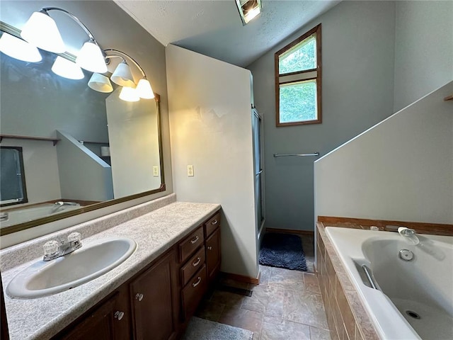 12185 Oak Meadow Dr, Rolla, MO 65401 - full bath with vanity, a garden tub, vaulted ceiling, an enclosed shower, and baseboards