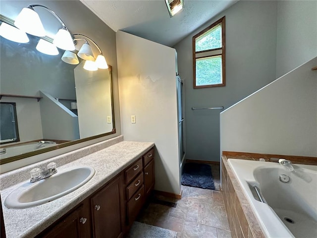 12185 Oak Meadow Dr, Rolla, MO 65401 - bathroom featuring vanity, a bath, vaulted ceiling, a stall shower, and baseboards